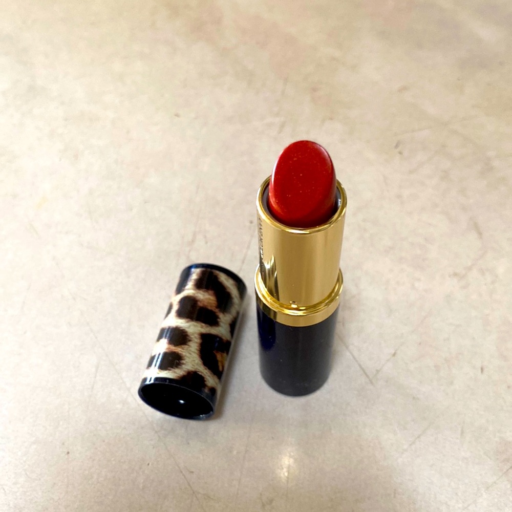Estée Lauder full size lipstick in Slow Burn.  Pure color envy.  Hi lustre.